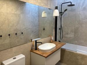 a bathroom with a sink and a shower at Duilius in Robe