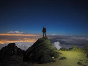 a person standing on top of a mountain at Hotel Chemy in Quito