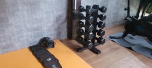 a gym with a bunch of dumbbells on a table at Matianellu SP in São Paulo +21 photos