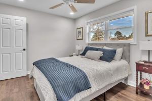 a bedroom with a bed and a window at The Friendship House in Columbus