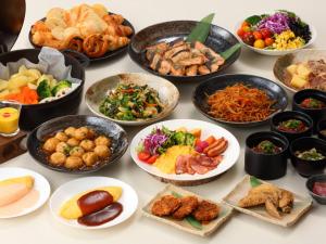 a table topped with bowls of different types of food at Nagoya Prince Hotel Sky Tower in Nagoya
