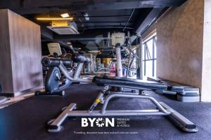 a gym with a cardio machine in a room at Premium Suites D'lement Genting Highlands by BYON in Genting Highlands