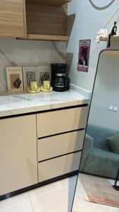 a kitchen with a counter top with a coffee maker at العليا in Tabuk