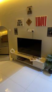 a living room with a large flat screen tv at العليا in Tabuk
