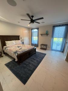 a bedroom with a bed and a ceiling fan at Buck island Breeze in Christiansted