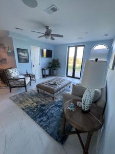 a living room with a couch and a table at Buck island Breeze in Christiansted