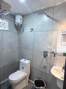 a bathroom with a toilet and a sink at Cozy Nook Inn - A BB Linens Experience in Vythiri +33 photos