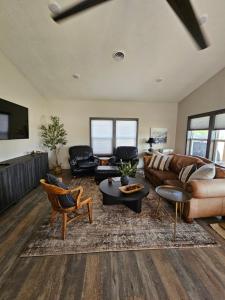 a living room with a couch and a table at Charming New Lake House in Pierre