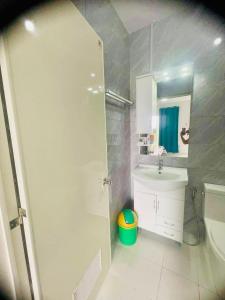 a bathroom with a shower and a sink and a toilet at The Avenue Hotel and Event Center in Manaoag +50 photos