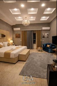 a large bedroom with a bed and a couch at GAP Cairo Hotel Downtown in Cairo
