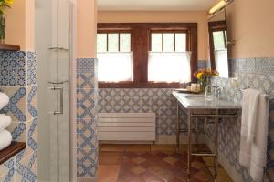 a bathroom with a sink and a shower at Pine Brook Manor in Sparrow Bush