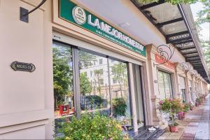 a store with a sign on the side of a building at La Mejor Homestay in Quang Tri