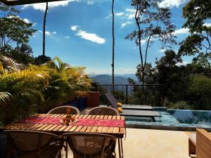 a table and chairs on a patio with a view at Indigo House, Villa Fez in San Francisco +7 photos