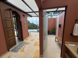 an open door to a hallway with a patio at Indigo House, Villa Fez in San Francisco