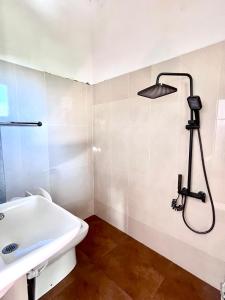 a bathroom with a sink and a shower at Studio Greenlands 2nd D-Battaramulla in Talangama South