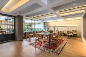 a dining room with a table and chairs at 79bogotá Boutique Suites in Bogotá