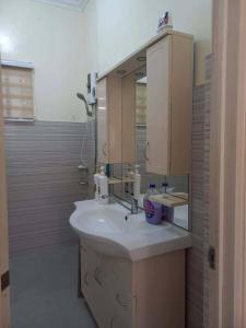 a bathroom with a sink and a mirror at Spacious Villa in Baclayon +9 photos