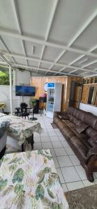 a living room with a couch and a table at White Beach Villa in Dauis