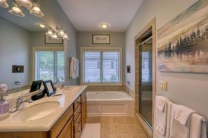 a bathroom with a tub and a sink and a shower at Sugar Mountain Condo, Sleep 4, Deck Mountain Views in Sugar Mountain