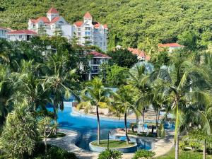an aerial view of a resort with palm trees at Yalong Sea Joy in Sanya