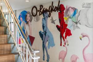 a mural of flamingos on a wall at BB House Rambuttri2 บีบี เฮ้าส์ รามบุตรี2 in Bangkok