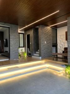 a living room with a fireplace in a house at The SeaNest Home - Làng Chài Mỹ Tân Ninh Thuận in Vinh Hai