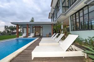 an image of a house with a swimming pool at Harmony Heaven Ubud by The Travel Ubud Bali in Ubud