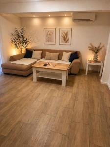 a living room with a couch and a table at Sasha Apartment and Swimming Pool in Gornje Selo
