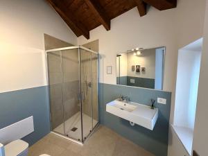 a bathroom with a sink and a shower at B&B Il Rosmarino in Galliate