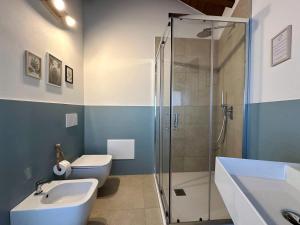 a bathroom with a shower and a toilet and a sink at B&B Il Rosmarino in Galliate