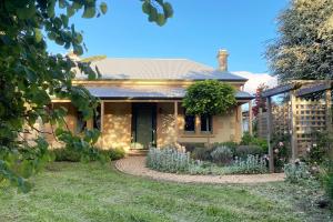 a house with a garden in front of it at Hidden Getaway in the City in Mount Gambier