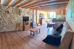 a living room with a couch and a table at La Grange in Mijanès