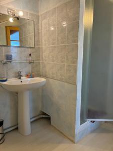 a bathroom with a sink and a mirror at La Grange in Mijanès +9 photos