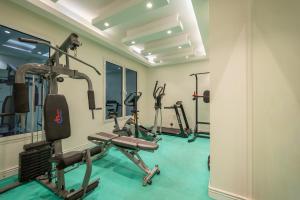a gym with several tread machines in a room at Weekend Hotel Sari in Jeddah