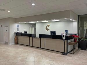 an office lobby with a reception desk with a crescent moon on the wall at Comfort Inn Conover-Hickory in Conover