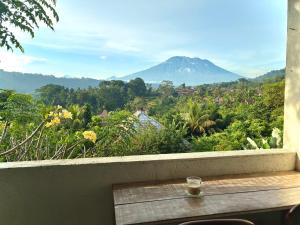 a window with a view of a mountain at Amrita Villa Sidemen in Sidemen +69 photos