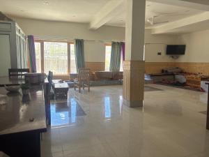 a living room with a couch and a table at Dod gu Yongs Khil in Karu