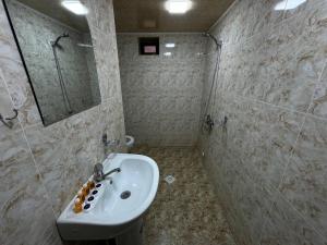 a bathroom with a sink and a shower at Hotel & Hostel Siyob Samarkand in Samarkand +30 photos