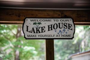 a sign that says welcome to our lake house at Fisherman's Countryside Escape in Scottsboro