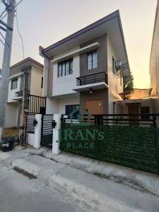 a house with a sign that reads teams place at JRAN's Place Home in Baliuag, Bulacan in Suliban