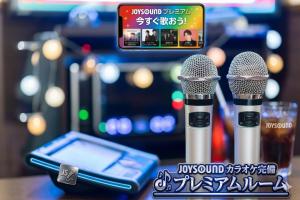 two microphones sitting on a table next to a cell phone at ホテル-ウォーターゲート-岐阜-大人用- in Gifu +34 photos