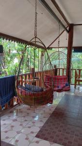 a hanging hammock in a pavilion with at Happy House Backpackers in Pai