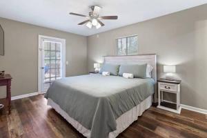 a bedroom with a bed and a ceiling fan at Quiet Getaway, Travis' Place! Affordable Location in Rossville
