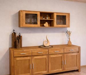 a wooden cabinet with two vases on top of it at Hebels Auszeit in Heimbach