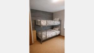 a bedroom with bunk beds in a room at Hebels Auszeit in Heimbach