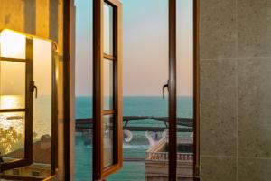 a view of the ocean from a window at HUB MULTI 3 HOTEL - Sea & Firework View in Phú Quốc