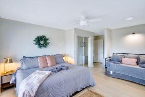 a bedroom with a large bed and a couch at Countryside Retreat with Views! Red Clay Farmhouse in Cleveland