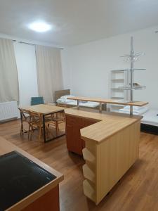 a room with desks and tables in a room at Apartmán Procyon in Prostějov