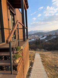 a stairway leading up to a house with a view at Shepit space in Slavske