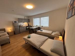 a living room with a couch and a table at Gästezimmer Fateev 4 in Senden